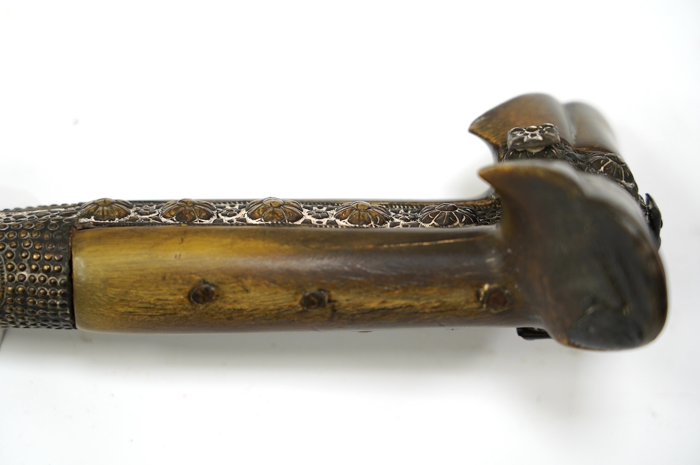 A 19th century Turkish Yataghan, blade inlaid with extensive inscriptions, embossed hilt, two piece horn grips, blade 55.5cm. Condition - good